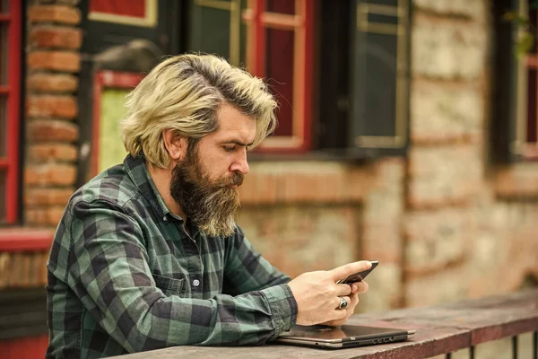 online distant education. hipster inspired to work. agile business. mature student working on computer. go shopping on cyber monday. bearded man in cafe with laptop and phone. Ready to study