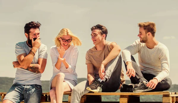 Family bonds. diverse young people talking together. group of four people. great fit for day off. happy men and girl relax. Group of people in casual wear. best friends. Summer vacation — Stock Photo, Image
