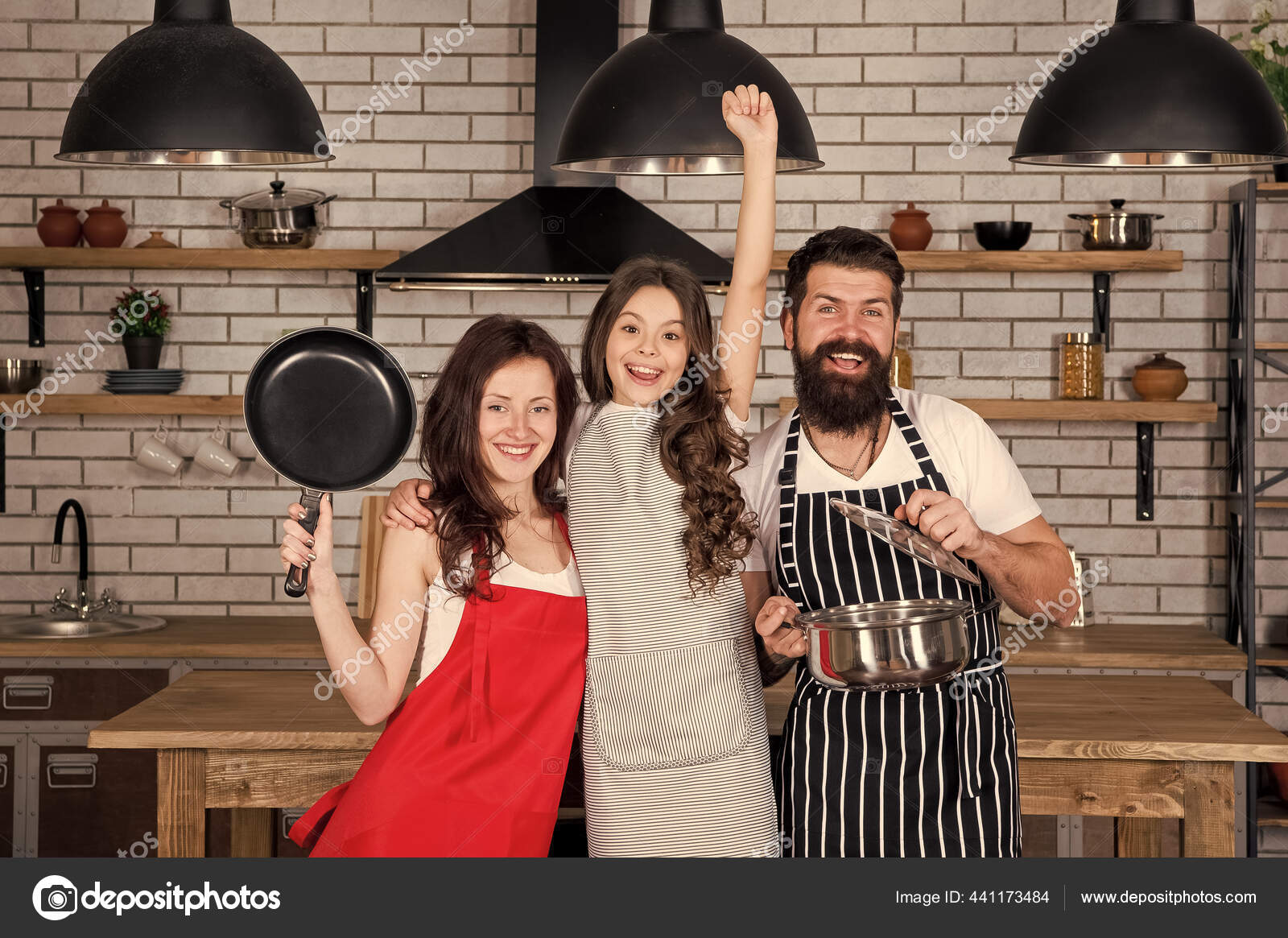 Together is more tasty. Mom dad and daughter aprons in kitchen. Cooking  concept. Prepare delicious breakfast. Lunch time. Family having fun cooking  together. Teach kid cooking food. Cooking together Stock Photo by ©