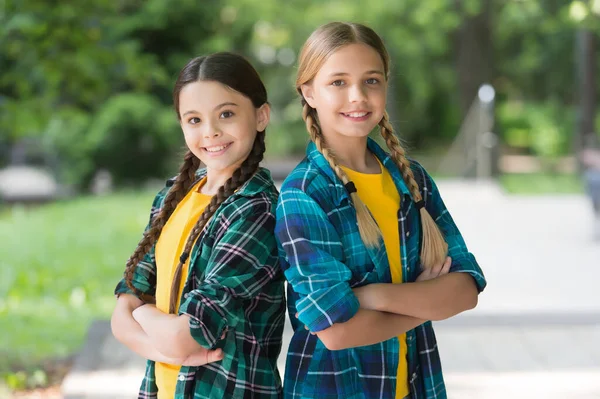 Childhood friends. Happy children have fun outdoors. Happy childhood. Enjoying leisure time. Childcare center. Childrens day. Summer vacation. School holidays. Casual fashion style