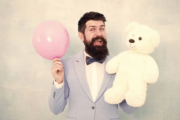 Greetings 8 march. Celebrate love. Valentines day. Romantic man with teddy bear and air balloon waiting girlfriend. Romantic gift. Macho ready romantic date. Man wear tuxedo bow tie. Womens day — Stock Photo, Image