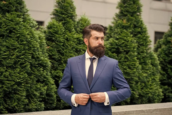 Business life. Man businessman classic style urban park. Successful and motivated. Business man bearded wear perfect fashionable suit. Businessman well groomed hairstyle beard. Business concept