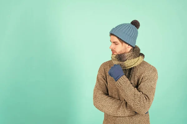 Copy space for advertisement. Man handsome unshaven guy wear winter accessories on blue background. Winter season sale. Hipster knitted winter hat scarf and gloves. Shopping concept. Clothes shop — Stock Photo, Image