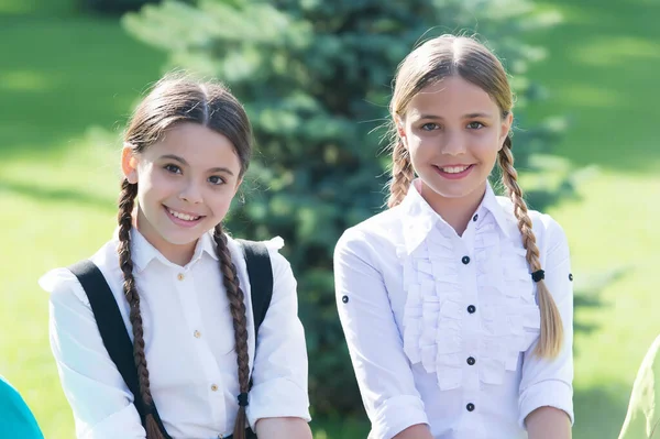 Happy school friends in formal uniform enjoy sunny day outdoors after school studies, classfellows — Stock Photo, Image