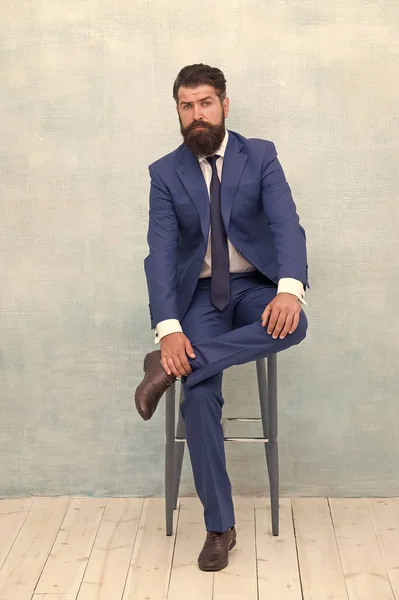 Classy style. Man bearded hipster wear classic suit outfit. Formal outfit.  Take good care of suit. Elegancy and male style. Businessman or host  fashionable outfit grey background. Fashion concept Stock Photo 
