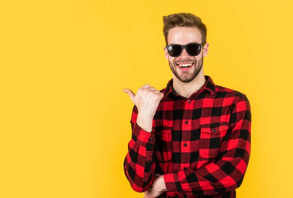 Stylish guy with trendy hairstyle wear checkered shirt and glasses, accessory — Stock Photo, Image