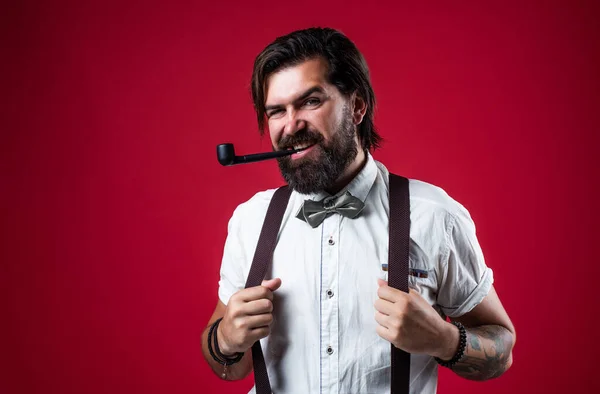 Male beauty standards. mature businessman in retro style. masculinity and charisma. formal party dress code. old fashioned bearded hipster smoke pipe. brutal handsome man with moustache smoking