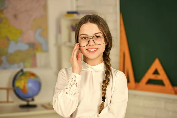 wearing glasses. autumn school time. Back to school. education in college. study geography map. mired in geometry. School girl hold at blackboard. Instrument of Measurement. different school elements