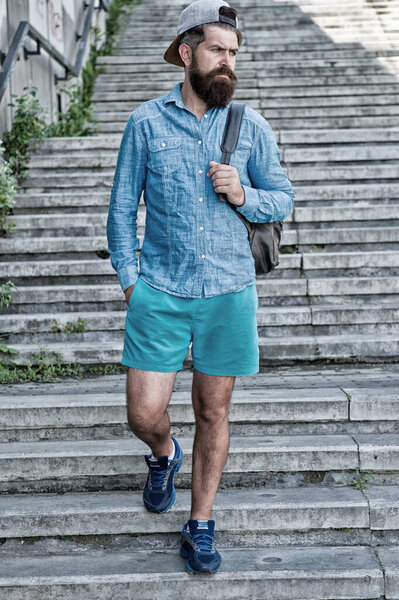 Man travelling explore city. Tourist on stairs go sightseeing. Plan holiday on budget. Travelling spontaneously is great. Slow travel has lot of benefits. Wanderer on tour. Budget travelling tips