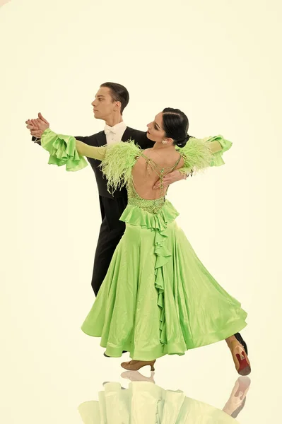 ballroom dance couple in a dance pose isolated on white background. ballroom sensual proffessional dancers dancing walz, tango, slowfox and quickstep just dance