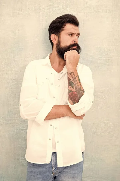 sexy model posing. bearded man wear white shirt. male casual fashion. summer collection. thoughtful male model in white shirt. brutal caucasian hipster with moustache. handsome man with beard
