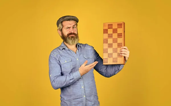 Teacher chess competition. Board game. Bearded man playing chess. Chess figures. Intellectual games. Game strategy concept. Chess lesson. Grandmaster experienced player. Cognitive development