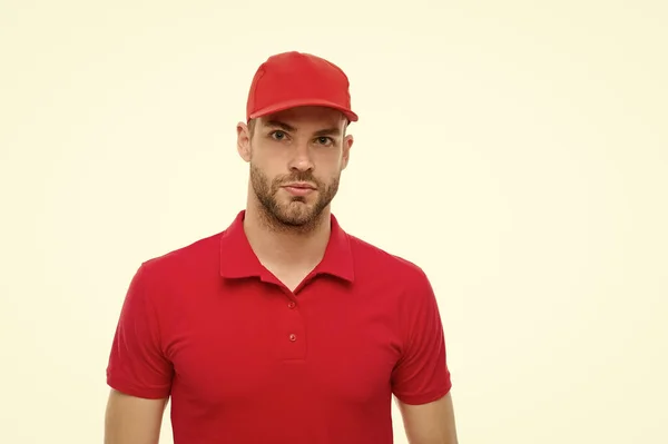 Working for your comfort. Man delivery service. Guy in red cap isolated on white background. Express courier service. Shipping and delivery service. Post worker. Help with relocation and move out — Stock Photo, Image