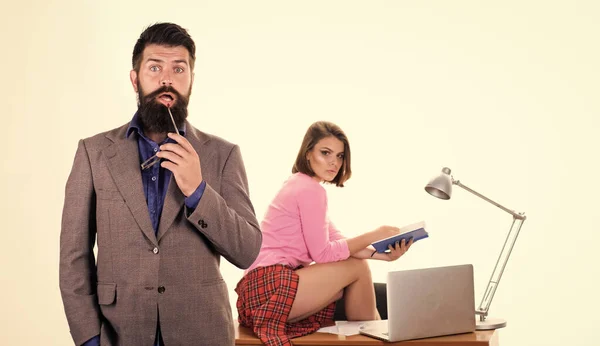 Sexy lady office worker. Sexy personal secretary. Full of desire. Office collective concept. Bearded boss stand in front of sexy girl working laptop. Sexual provocation. Office manager or secretary — Stock Photo, Image