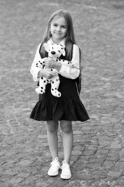 Play and learning go hand-in-hand. Happy kid play with toy dog outdoors. Child development and learning. Preschool education. Playschool and daycare. Creativity and imagination. Social skills — Stock Photo, Image