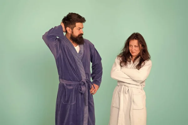 Sleepy people blue background. Couple in love bathrobes. Sleep disorders. Drowsy and weak in morning. Morning routine. Couple sleepy faces clothes for sleep. All day pajamas. Quarantine concept