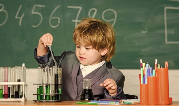 Result. Medical concept. Little genius child. testing tubes with liquid for research. small boy study chemistry. learn for future. Biology science. small boy - Confident medical expert — Stock Photo, Image