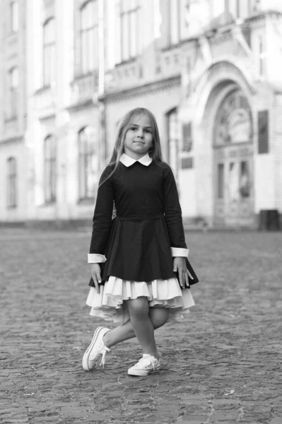 Practice makes perfect. Little kid make curtsy outdoors. Small ballerina wear uniform. Back to school fashion. Formal dress code. September 1. Back to school. Dance education. Dancing is perfection