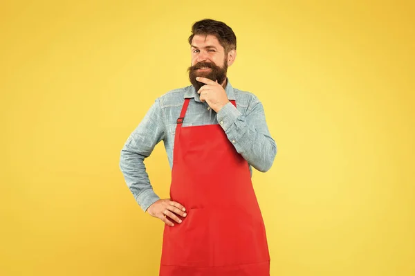 Enjoying new day. bearded man in cook uniform. confident male housekeeper. business shop owner. mature shop assistant. professional chef in red apron. restaurant staff wanted. cooking is his hobby — Stock Photo, Image