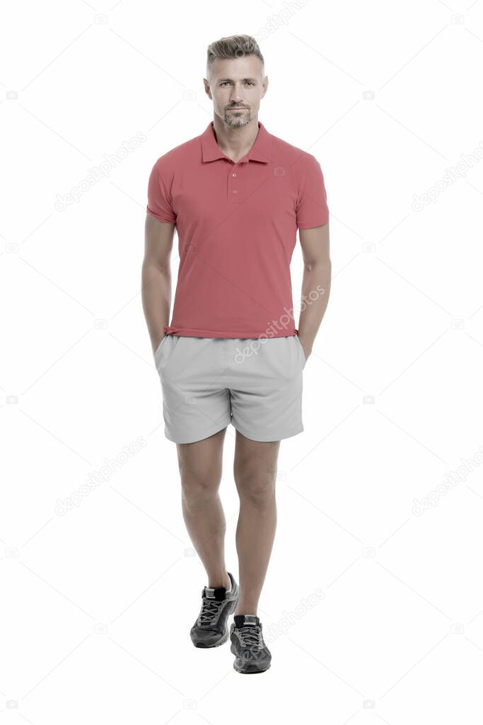 Sport style. Menswear and fashionable clothing. Man calm face posing confidently white background. Man looks handsome in shirt and shorts. Guy sport outfit. Fashion concept. Man model clothes shop