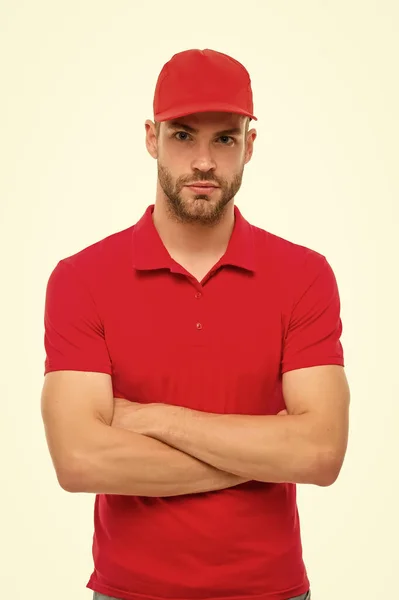 Post worker. Help with relocation and move out. Working for your comfort. Man delivery service. Guy in red cap isolated on white background. Express courier service. Shipping and delivery service — Stock Photo, Image