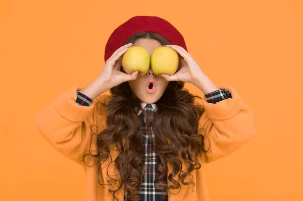 Impressing harvest. Girl cute long curly hair hold apples. Child girl emotional face expression. Delicious harvest. Harvest season. Child kid surprised face hold apples. Healthy food concept — Stock Photo, Image