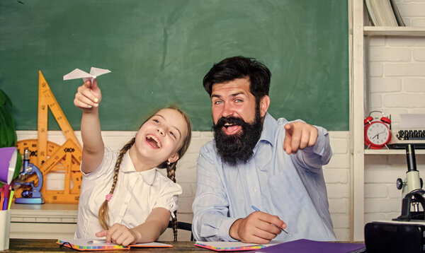 Man bearded pedagogue and pupil having fun. Developing caring learners who are actively growing and achieving. School learners leisure. Creating a community of learners. Teacher and schoolgirl