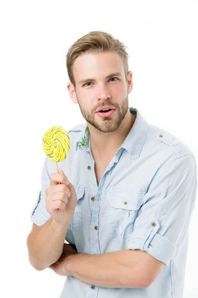 Do you know. Impressing fact harmful sugar nutrition. Man handsome bearded guy holds lollipop candy. Man with lollipop looks puzzled. Healthy nutrition and dieting concept. Harmful effect of sugar — Stock Photo, Image