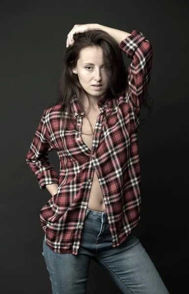 Country style. Woman wear checkered shirt. Rustic and country. Attractive girl. Sexy people. Youth fashion. Fashionable outfit. Simple casual clothes. Feeling comfortable. Country music concept