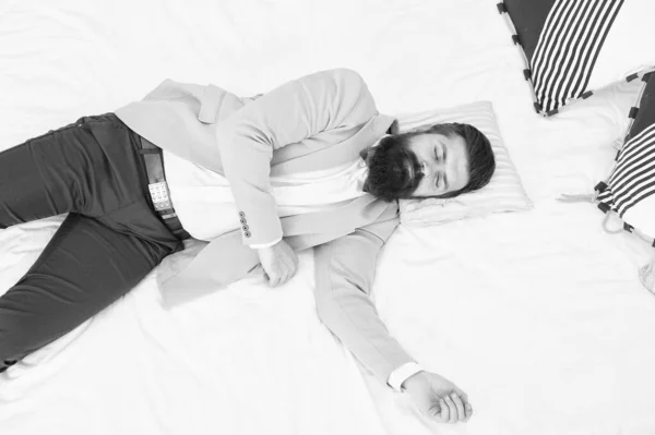 Single to mingle. Single man sleep in formalwear. Bearded man lying in bed alone. Wedding guest. Bachelor or bridegroom in hotel room. Dating site for single. His engagement is broken off