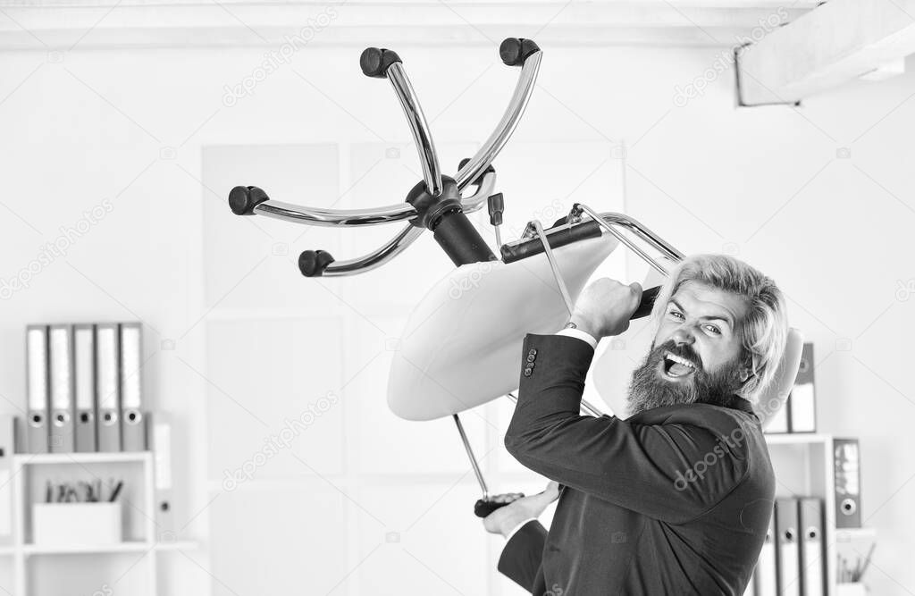 Throw out chair. Get out of my office. Drive out uninvited guest. Stress concept. Crazy or mad. Businessman standing in office hold chair. Business man aggressive. Hipster man angry with office chair