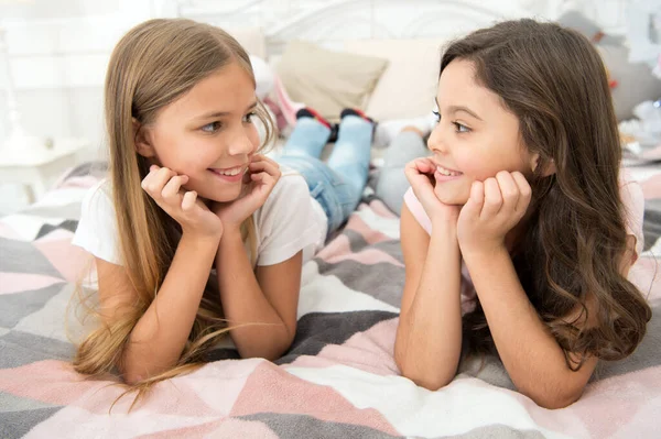 Dont stop smiling everyday. Happy children smiling. Smiling girls relax on bed. Childrens dentist. Kids dentistry. Dental clinic. Keep smiling — Stock Photo, Image