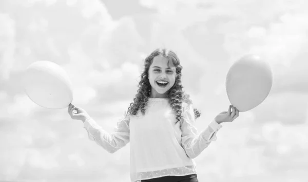 Creative idea. happy birthday party. small girl with party balloon. summer holidays and vacation. childhood happiness. feeling free and carefree. little kid in spring holiday. cheerful child have fun