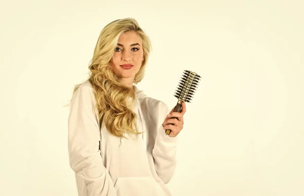 Long hair. Hair care. Hairdresser salon. Professional equipment. Easy hairdo. Beauty supplies. Avoid over drying and overheating. Hot curling brush. Pretty woman brushing hair isolated on white