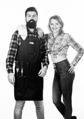 Family weekend. Couple in love hold kitchen utensils. Man bearded hipster and girl. Preparation. Tools for roasting meat outdoor. Picnic barbecue. food cooking recipe. Secret ingredient is love