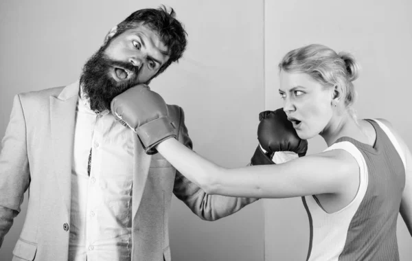 bearded man hipster fighting with woman. Strength and power. knockout punching. who is right. win the fight. family couple boxing gloves. problems in relationship. sport. Boxing sport concept