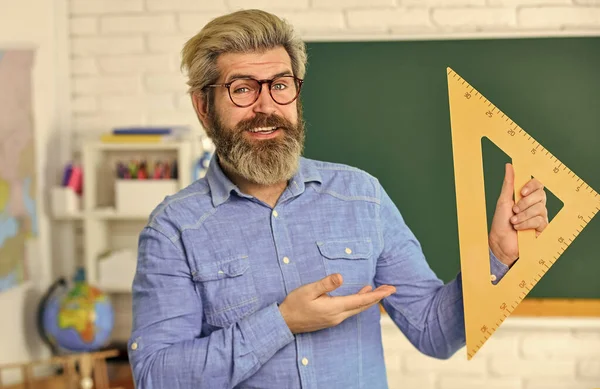 Study mathematics. Mature bearded teacher in glasses. Education concept. Talented pedagogue. Private lesson. Back to school. Man teacher mentoring school projects. Science modern school. Math subject