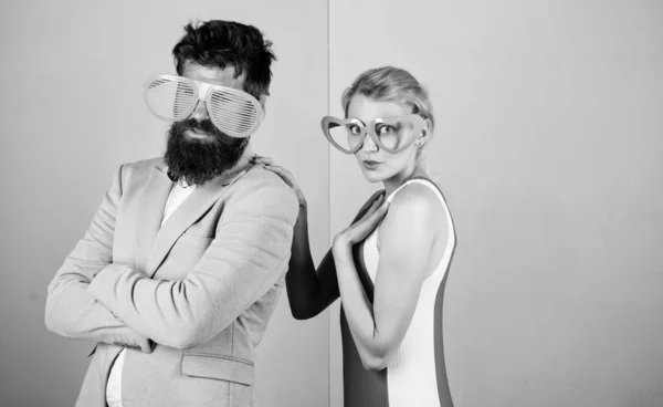 Photo booth props. party fun. couple in love. hipster guy and girl party glasses. friendship. lets celebrate together. Office party. Best friends relations. bearded man with pretty woman — Stock Photo, Image