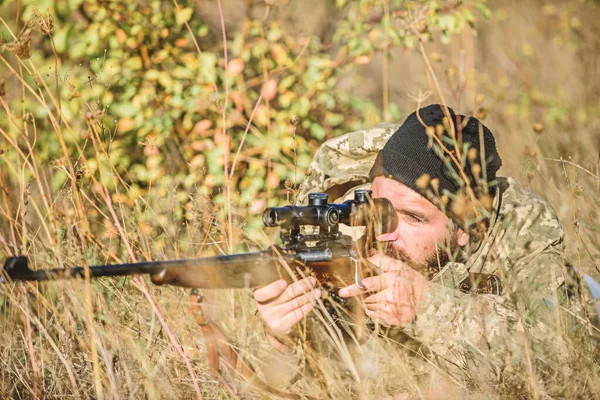 Bearded man hunter. Military uniform fashion. Army forces. Camouflage. Hunting skills and weapon equipment. How turn hunting into hobby. Man hunter with rifle gun. Boot camp. Military action. — Stock Photo, Image