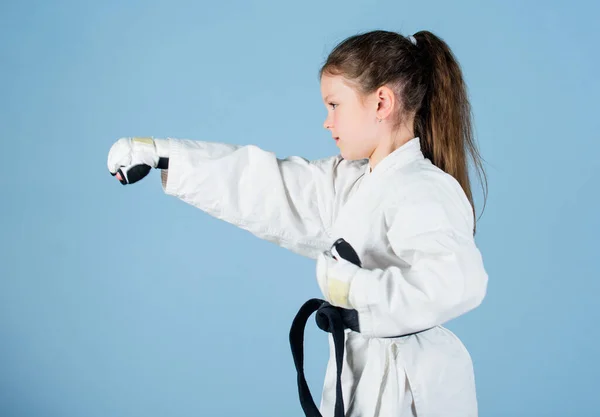 Sport success in single combat. practicing Kung Fu. happy childhood. little girl in gi sportswear. small girl in martial arts uniform. knockout. energy and activity for kids. Free your mind — Stock Photo, Image