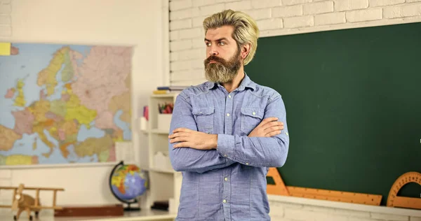 Educational concept. mature bearded teacher. back to school. develop logic and creativity. start the brain engine. physics research. math teacher at blackboard. education. exact sciences