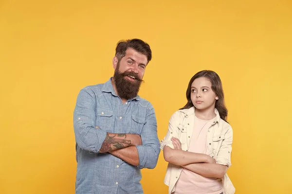 Loving their casual look. Small child and bearded man in casual style. Father and little daughter yellow background. Casual fashion. Casual appeal. Family clothing store. Fashion and style — Stock Photo, Image