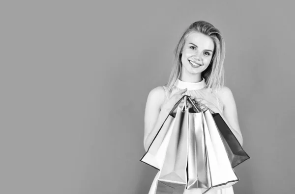 Cyber monday concept. gifts and presents for any holiday. fashion model with paper bag packages. sell out and give-away. real female shopaholic. happy shopper. after successful shopping. copy space — Stock Photo, Image