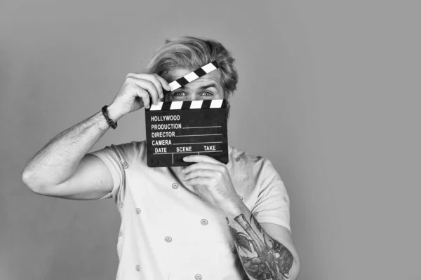 Actor casting. Shooting scene. Favorite series. Cinema production. Creative producer. Bearded man hold movie clapper. Film maker. Clapperboard copy space. Comedy or drama. Watch movie. Film director — Stock Photo, Image