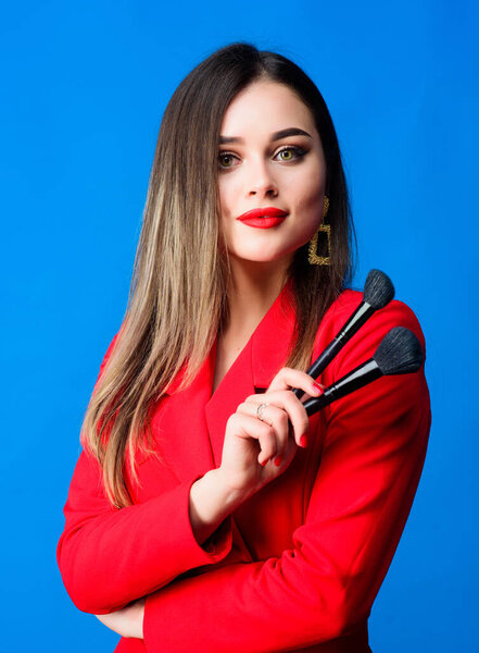 Gorgeous lady makeup red lips. Attractive woman applying makeup brush. Strengthen confidence with bright makeup. Perfect skin tone. Makeup artist concept. Looking good and feeling confident