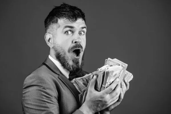 Cash transaction business. Man happy winner rich hold pile of dollar banknotes blue background. Easy cash loans. Businessman got cash money. Win lottery concept. Get cash easy and quickly — Stock Photo, Image