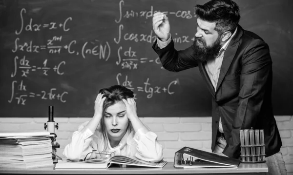 Rebuke and punishment. You should make more efforts. Arguing about study. Conflict situation. School conflict. Demanding lecturer. Teacher strict serious bearded man having conflict with student girl