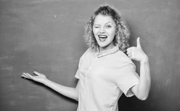 Education success. Students life. back to school. woman likes studying. woman teacher at school lesson. knowledge day. empty blackboard information. winking student at blackboard. thumb up — Stock Photo, Image