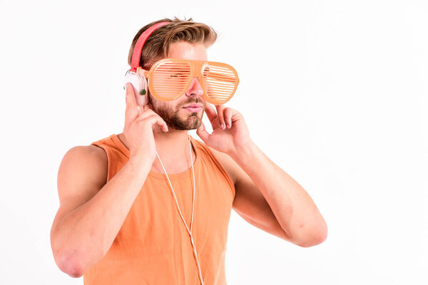 Listening Music Earphones Concept. mp3 player. sexy muscular man listen music on phone mp3 player. man with mp3 player on phone isolated on white. unshaven man in headphones