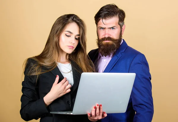 Inspired to work hard. sexy woman secretary looking in computer. businessman with partner. communication and meeting. modern technology. business couple. confident mature man with laptop — Stock Photo, Image